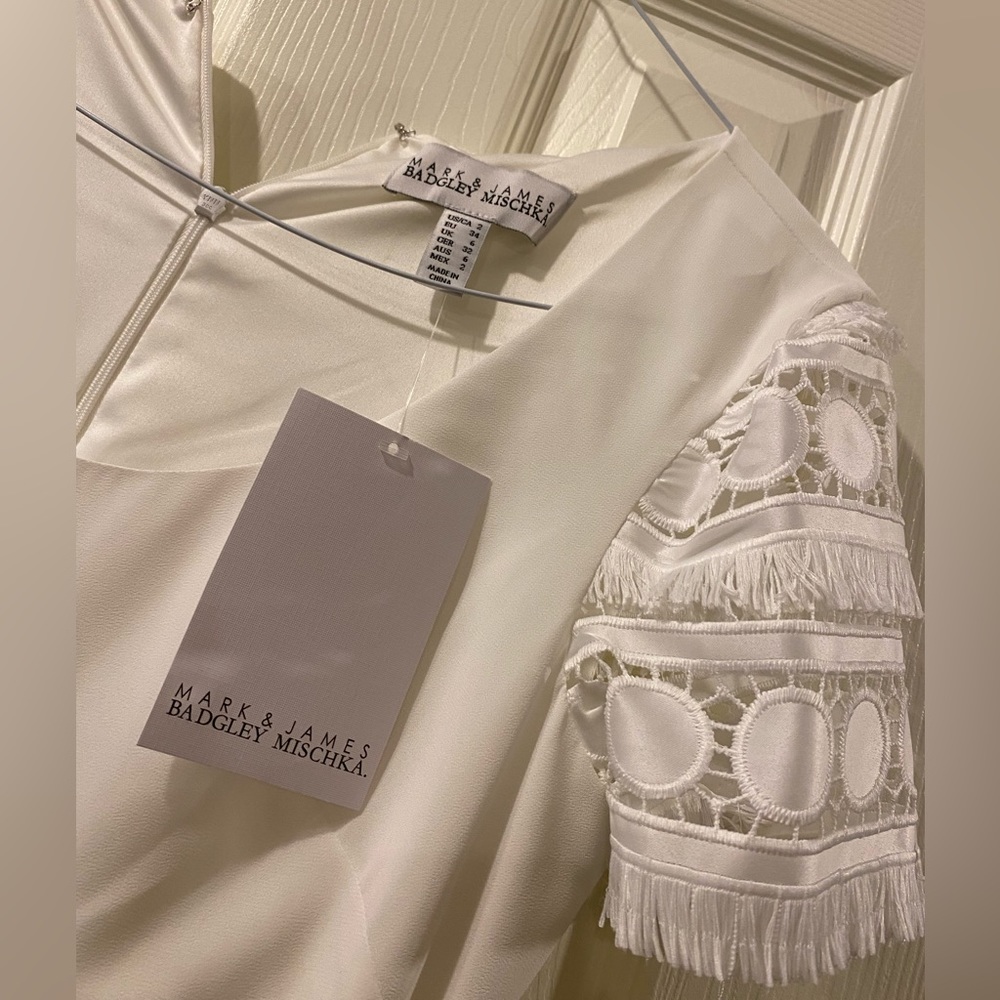 Beautiful badgley Mischka dress white with laser cut detail and belt